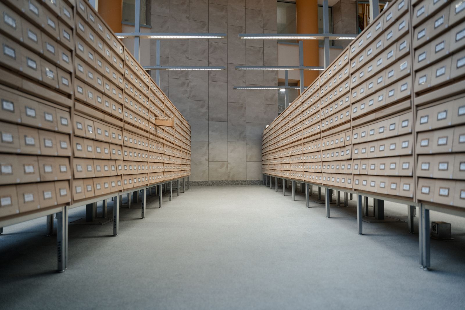 Rows of labelled index drawers in an archive reading room