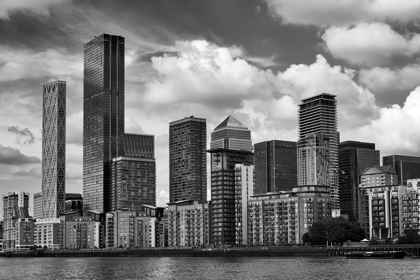 The Canary Wharf skyline from the Thames in black and white